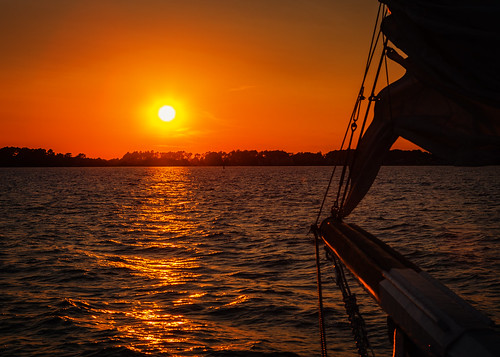 sunset orange sun water lines silhouette composition sailboat bay sailing maryland easternshore bow sail sheet chesapeakebay headinghome ruleofthirds sunsetcruise prow tilghmanisland leadingline
