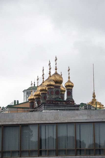 Golden onion domes and crosses top the Kremlin's Church of the Nativity Moscow Russia