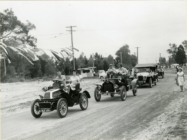Procession of vintage cars at the Bribie Bridge opening, Moreton Bay Region