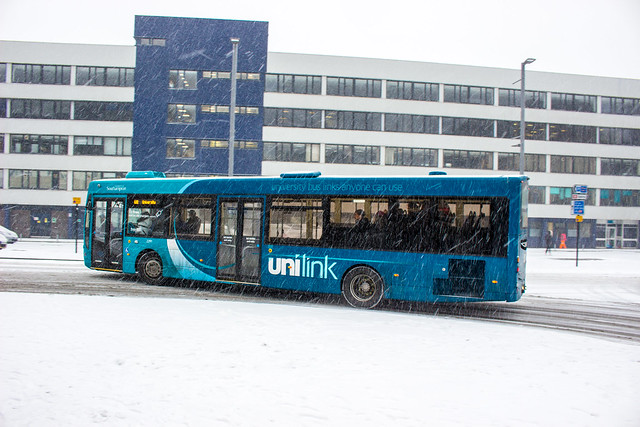 Unilink branded buses operating through the snow during Storm Emma