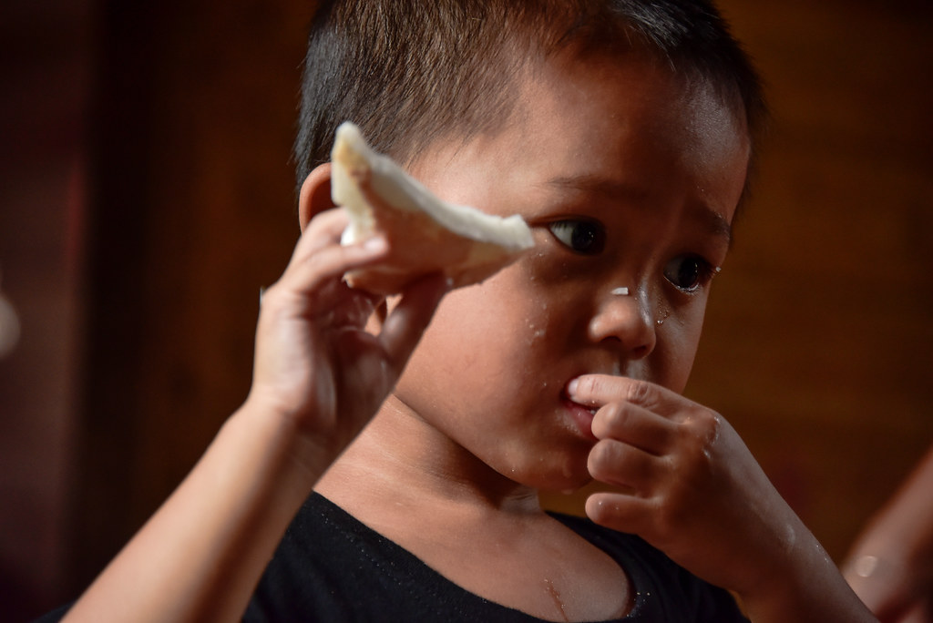 Child eating coconut. Photo by Icaro Cooke Vieira/CIFOR cifor.org forestsnews.cifor.org...
