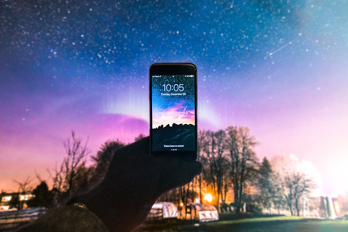 astronomy atmosphere blue cellphone clouds dark device electronics evening hand holding illuminated iphone iphone6 landscape lights longexposure mobile phone night sky outdoors road screen silhouettes smartphone space starrynight stars takingphoto technology timelapse trees