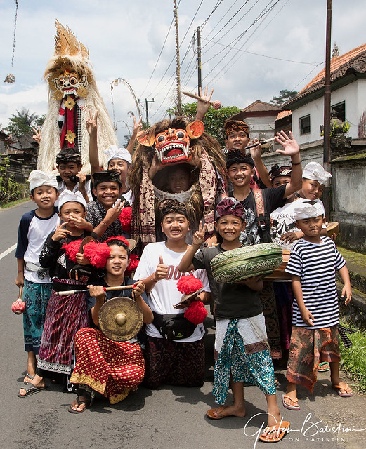 Kids band collecting money for the temple. Budakeling village, Bali, Indonesia