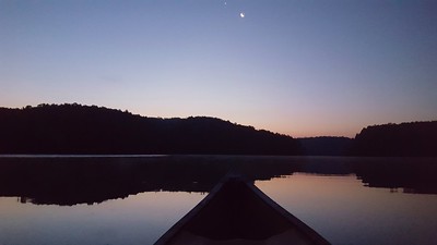 Nighttime canoe ride under the moon.