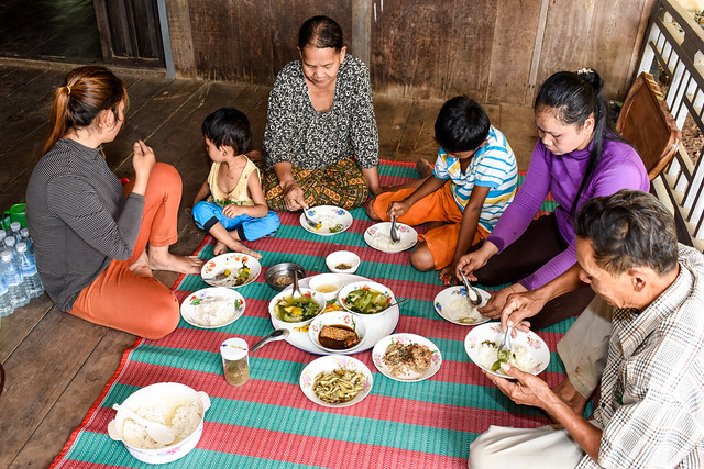 Family having meal in Kralanh District, Siem Reap Province, Cambodia. Photo by Finn Thilsted.