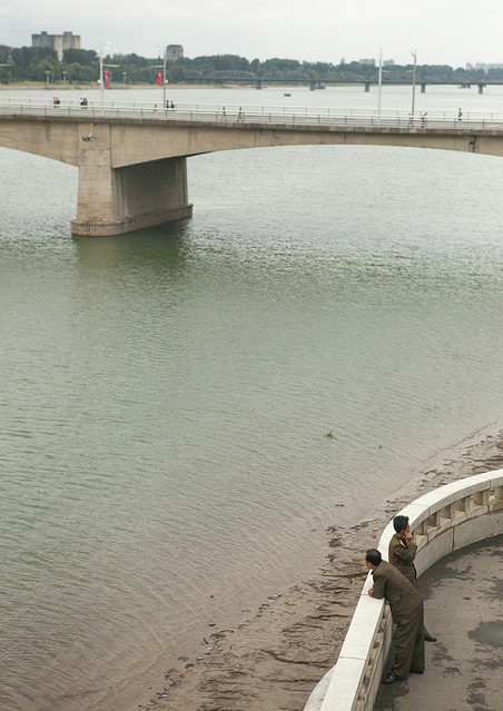 North Korean soldiers looking over Taedong river, Pyongan Province, Pyongyang, North Korea