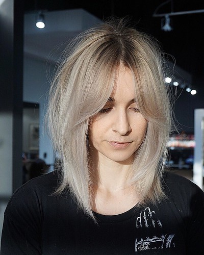 Shaggy Curtain Banged Lob with Undone Straight Texture and Platinum Blonde Color Medium Length Hairstyle