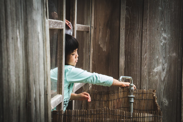 Kid washing her hands in Ishigaki island, Japan
