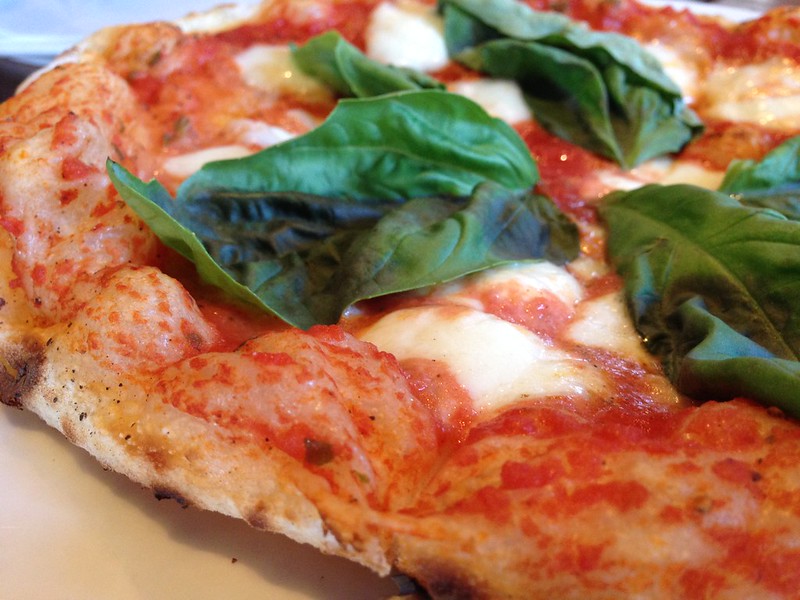 Pizza Margherita: tomato, house-pulled Mozzarella cheese, and basil