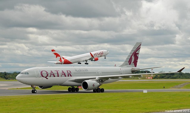 Air Canada departs manchester with Qatar airways arriving