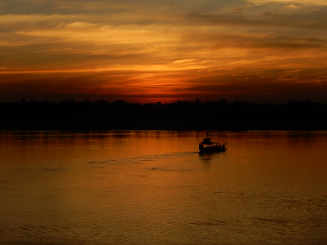 crossing the Mekong at sunset