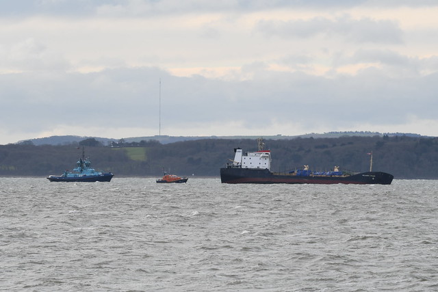 Russian Cargo Ship 'Mekhanik Yartsev' listing considerably in The Solent. Bembridge RNLI Lifeboat 16-17 and Solent Towage Tug 25 'Apex' on standby.
