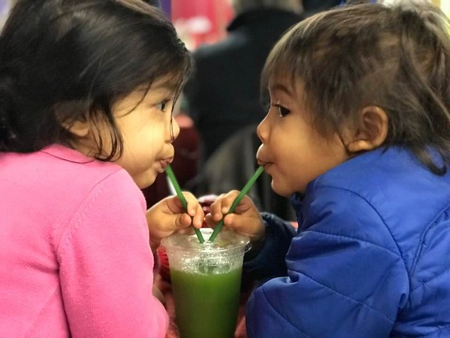 Twins, Sarika & Devie, sharing a healthy smoothy at the farmers' market in North Kingstown