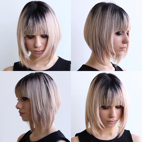 Blonde Razor Cut Angled Bob with Full Blunt Bangs and Black Shadow Root