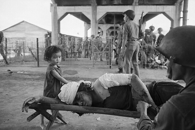 Vietnamese Child With Wounded Mother