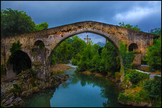 Old Roman Bridge in Cangas de Onis with Asturian Cross