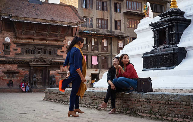 Nepali girls near stupa and Newari houses, Kathmandu, Nepal