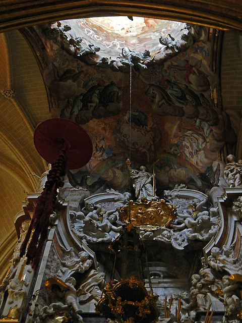 The interior dome of the Toledo Cathedral in Spain is painted with a heavenly scene ringed by sculptures of cherubs