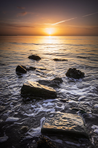 beach rocks sunrise shore waves