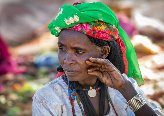 Oromo woman in a market with a colorful headwear, Amhara region, Senbete, Ethiopia