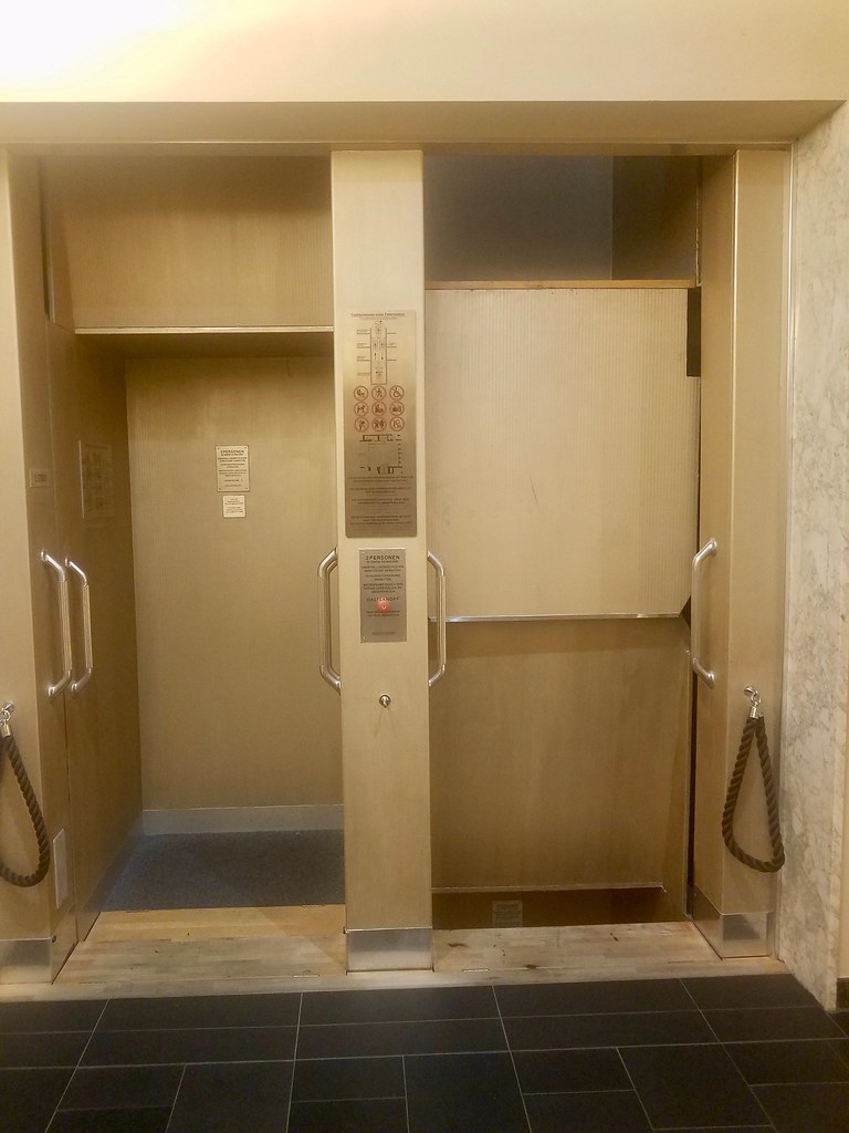 Crazy paternoster elevator. Photo by howderfamily.com; (CC BY-NC-SA 2.0)