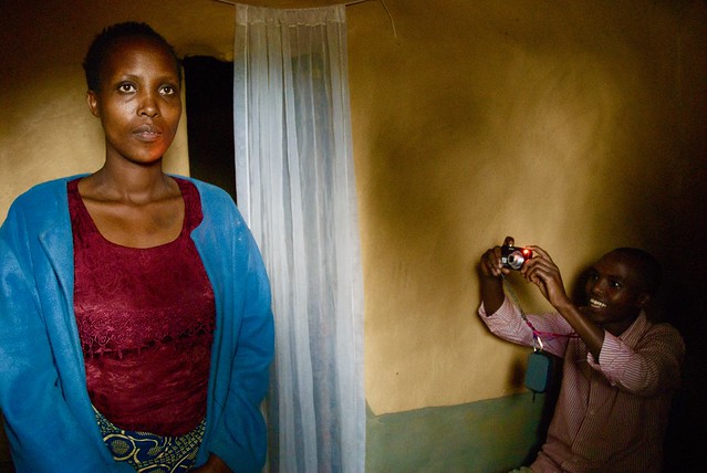 Refugee Photographer Byishimo Baptiste Photographs His Mother Inside Their Home