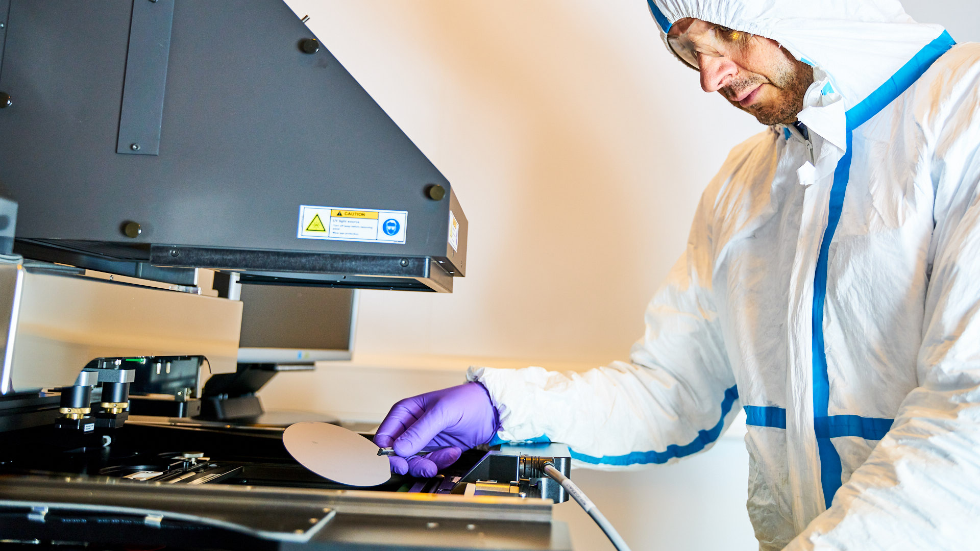 Researcher working the nanoimprint Lithography system at the University of Bath
