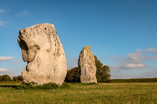avebury stone circle standing henge wiltshire england archaeology neolithic megalithic grass field tree bank landscape