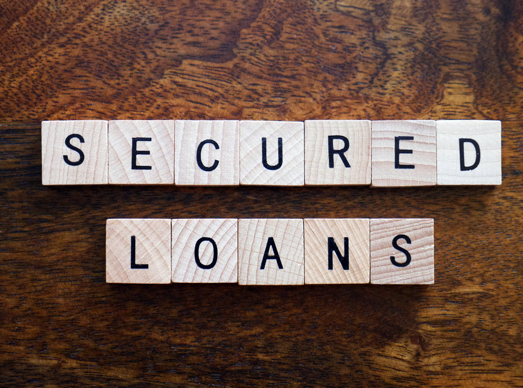 Secured loans with online decisions and free valuations