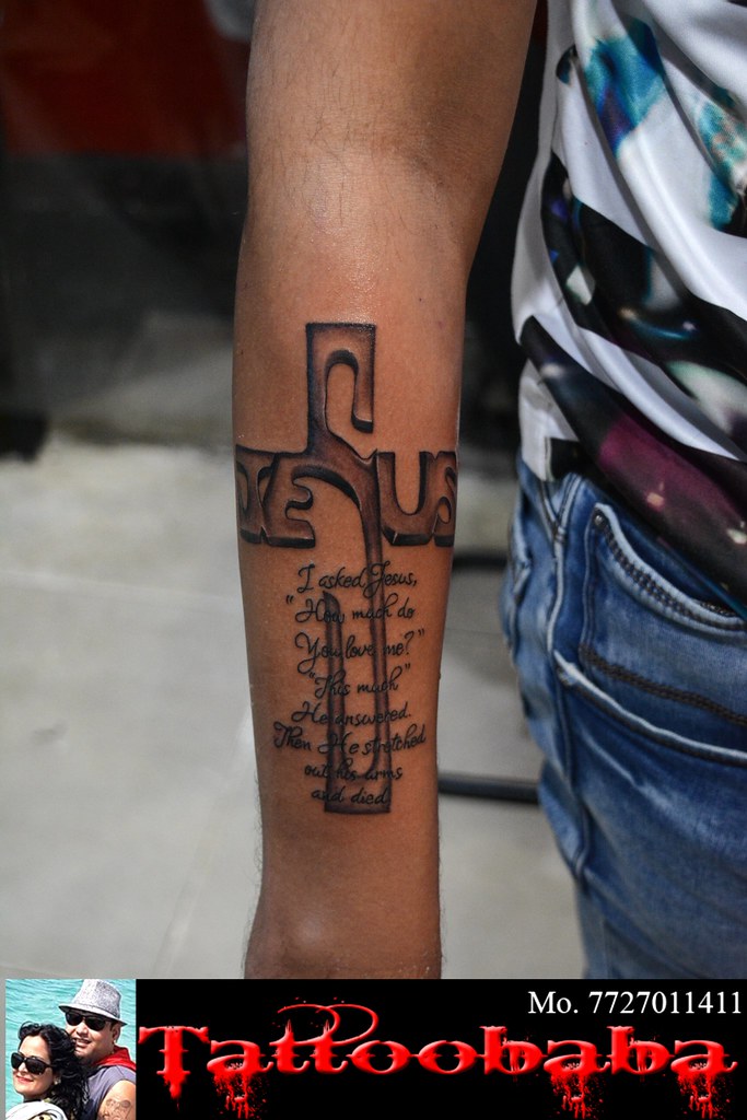 Cross with writing combine tattoo done at#tattoobaba Conta… | Flickr