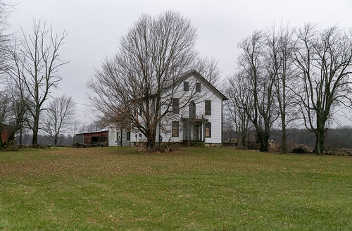 christiansillman house dwelling residence farmhouse twostory frontgabled attica ohio unitedstates us gothicrevival scrollwork porch asbestossiding 11windows altered abandoned vacant trees grass twinentries venicetownship carrothers senecacounty