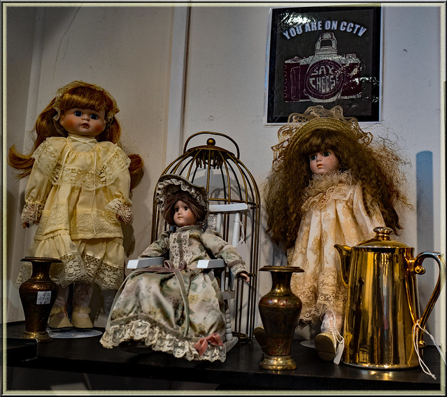 Unusual shop display with dolls and more.....say cheese!