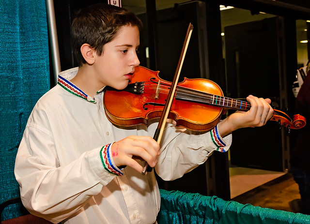 Russian boy plays violin at the 34th annual Mobile International Festival in Mobile Alabama