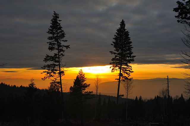 Sunset with lots of slash piles are burning in the valley,  Lake Country BC