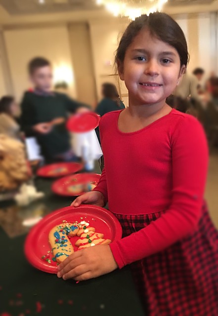 Breakfast with Santa! At a clients venue, we hosted breakfast with Santa and had different stations for kids to make things. She was so proud of the cookie she decorated. “I really like art,” she told me.