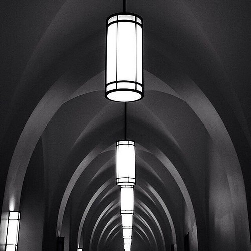 Day 162 of @DocumentDuke360: "I took this shot of the illuminated Duke Divinity School hallway on my way to another source of evening illumination: the University Course. This semester, the University Course offers a multidisciplinary approach to Critical
