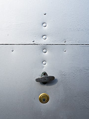 Garage door lock and rivets