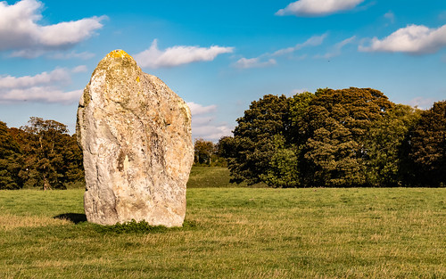 avebury sarsen standing stone circle megalithic wiltshire england landscape field grass tree henge sky