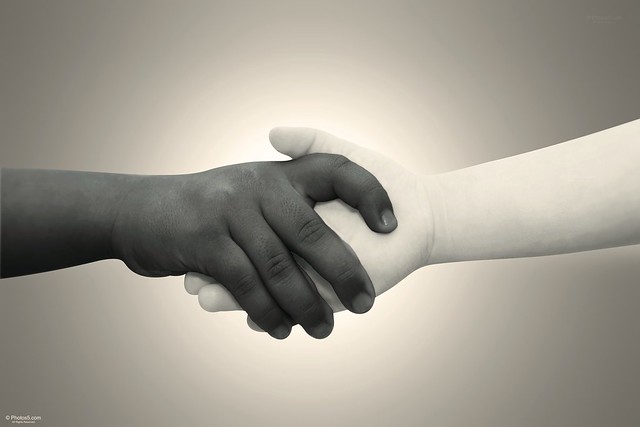 Black and White Kids Shake Hands