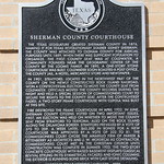 Sherman County Courthouse Historic Marker (Stratford, Texas) Historic marker for the 1923 Sherman County Courthouse in Stratford, Texas.  The building was designated as a Recorded Texas Historic Landmark in 2008.  The marker’s text reads:

“The Texas Legislature created Sherman County in 1876, naming it for Texas Revolutionary soldier Sidney Sherman. The county was attached to Oldham County for judicial purposes until 1889, when there was sufficient population to organize. The first county seat was at Coldwater, a community founded near the geographic center of the county by the Loomis family. In 1890, a one-story stone courthouse was built. Coldwater soon boasted a post office, the county jail, a hotel, mercantile store and newspaper. In 1901, Stratford, located in the northwest part of the county on the newly constructed Rock Island Railroad, won a controversial election to move the county seat from Coldwater. Officials moved the county records during the night and held a special session of Commissioners Court to secure the rights to the county seat. After the controversy faded, a two-story frame courthouse with cupola was built at this site. Fire destroyed the frame courthouse in April 1922. In June, Sherman County citizens voted on two important issues. First, an election was held on whether to move the county seat from Stratford to Texhoma, also on the rock island along the Oklahoma border. Stratford prevailed by a vote of 370 to 209. A week later, $62,500 in bonds for a new courthouse was approved by a vote of 322 to 81. The commissioners court chose the Amarillo firm of Parker &amp;amp; Rittenberry as architects and J. W. Mordecai as contractor. Commissioners Court met in the Christian Church until construction was complete in summer 1923. The two-story concrete courthouse with raised basement displays classical revival styling in its symmetrical facades and ionic columns. The exterior is running bond brick with cast stone detailing. RECORDED TEXAS HISTORIC LANDMARK – 2008.”