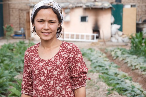 Farmer managing her kitchen garden in rural Tajikistan.