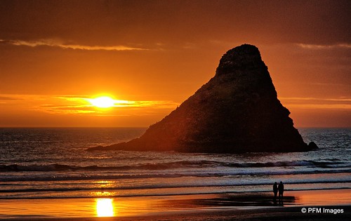 heceta beach oregon sunset couple romantic orange yellow waves sand coast coastal silhouette clouds sky amber people seastack outdoor waterscape landscape nature flickr reflection canon eos slr rebel t1i color colors colorful