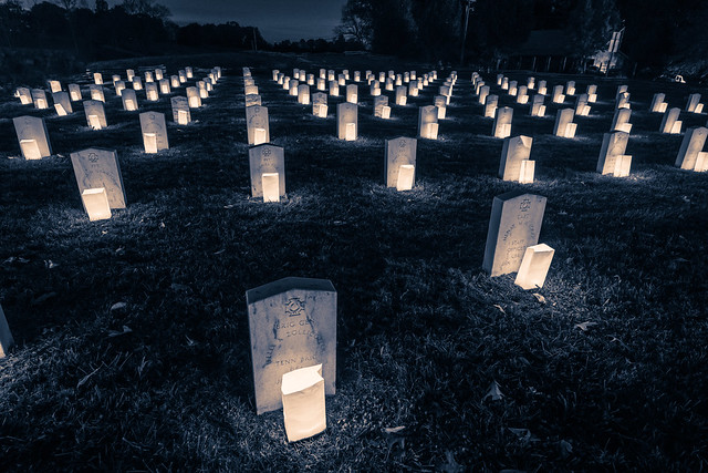 Candles light Confederate graves
