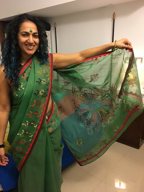in Neeta's beautiful green embroidered sari