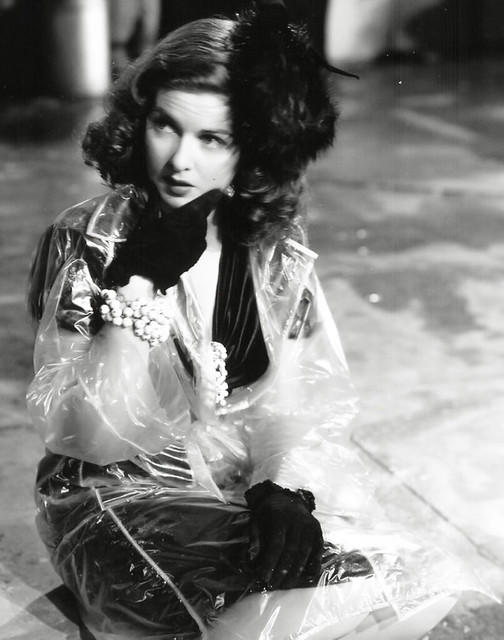 Joan Bennett in clear vinyl raincoat