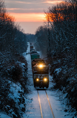 ns norfolk southern ge ac44c6m train trains railroad rail way manifest freight snow winter sunset rural orange low light lit 4012
