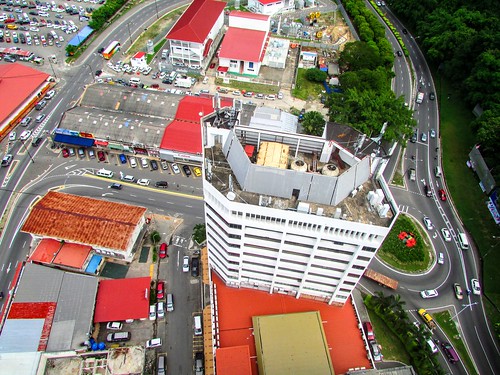 places views down above heights building roofs windows shophouses cars vehicles traffic roundabout lanes lines arrows wismaperkasa perspective kotakinabalu sabah malaysia borneo thienzieyung