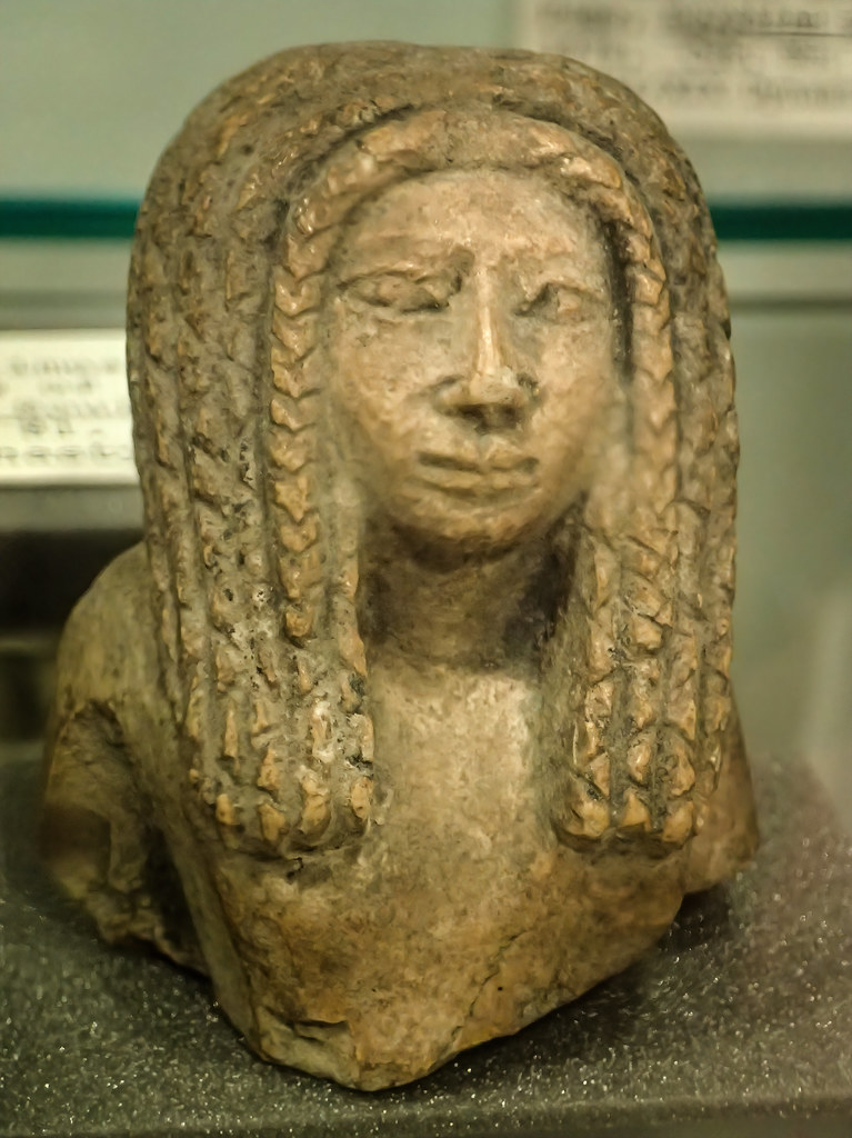 Upper part of a limestone statuette of a woman New Kingdom 18th-19th dynasty Egypt  1549-1189 BCE