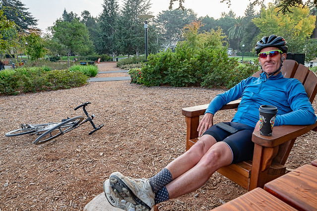 Cyclist relaxes in Stanford University garden