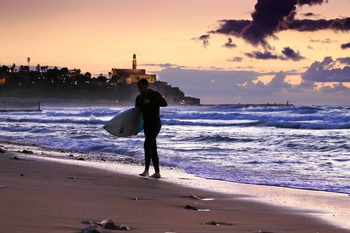surferatsunsettelavivbeach surfer sunset telaviv travelinisrael telavivbeach